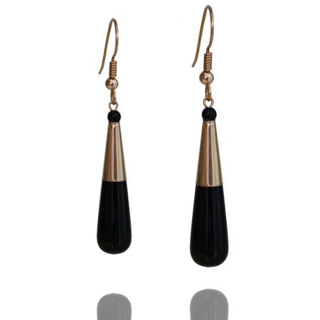 Gold and onyx earrings by Deberitz.
